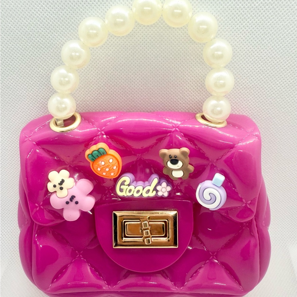 Pink Quilted Handbag with Pearl Handle and a Gold Plated Shoulder Strap.
